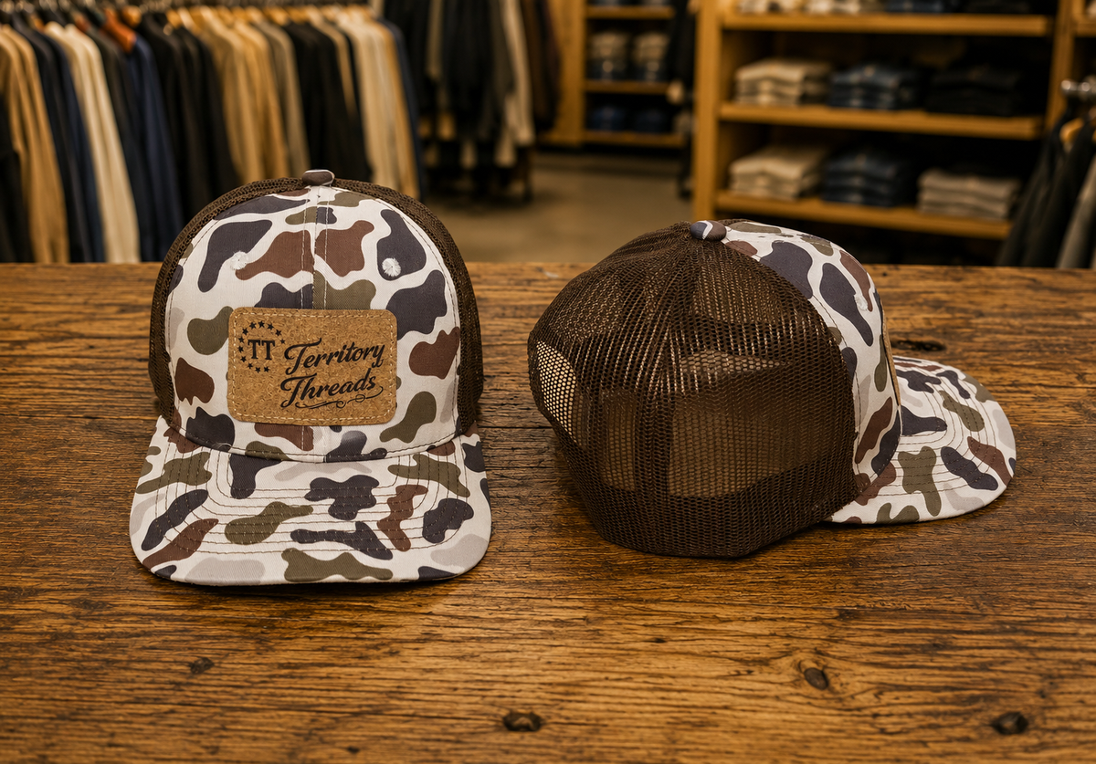Territory Threads duck camo hat with brown mesh back and cork textured patch front