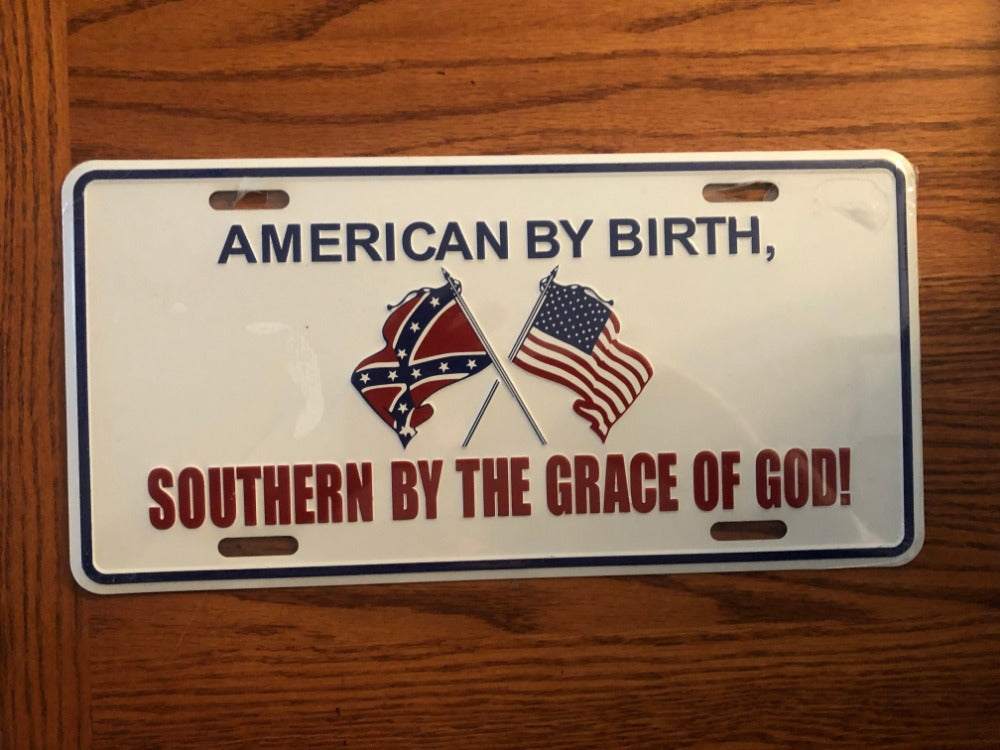 American by Birth Southern by the Grace of God embossed aluminum license plate tag with six mounting holes and weather-resistant finish
