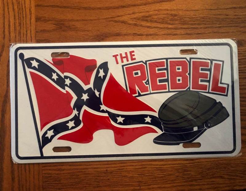 The Rebel License Plate Tag on a vehicle, durable aluminum, 11-3/4" x 6", wrapped in plastic, novelty car accessory