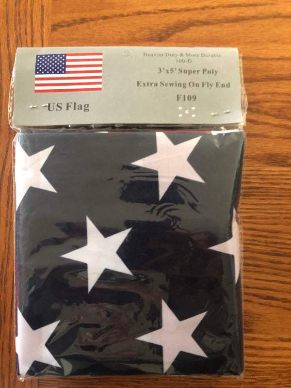 3x5 foot American Flag with stars and stripes on polyester fabric with brass grommets for hanging