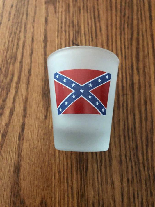 Frosted shot glass with battle flag and inscription "Here's to: Younger Women, Older Whiskey, Faster Horses, More Money"
