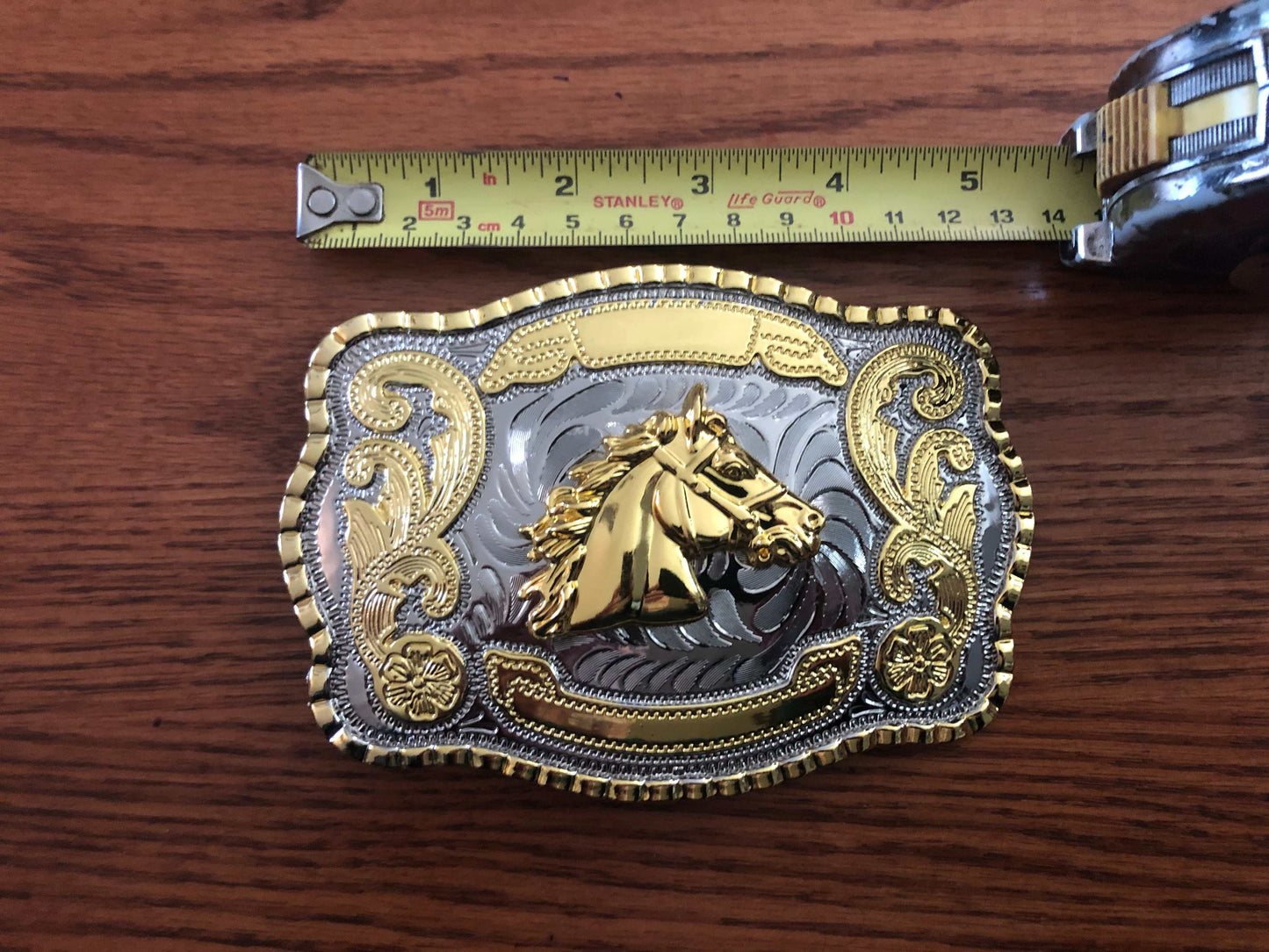 Big Western Huge Horse Head Shiny Metal Belt Buckle showing width with ruler